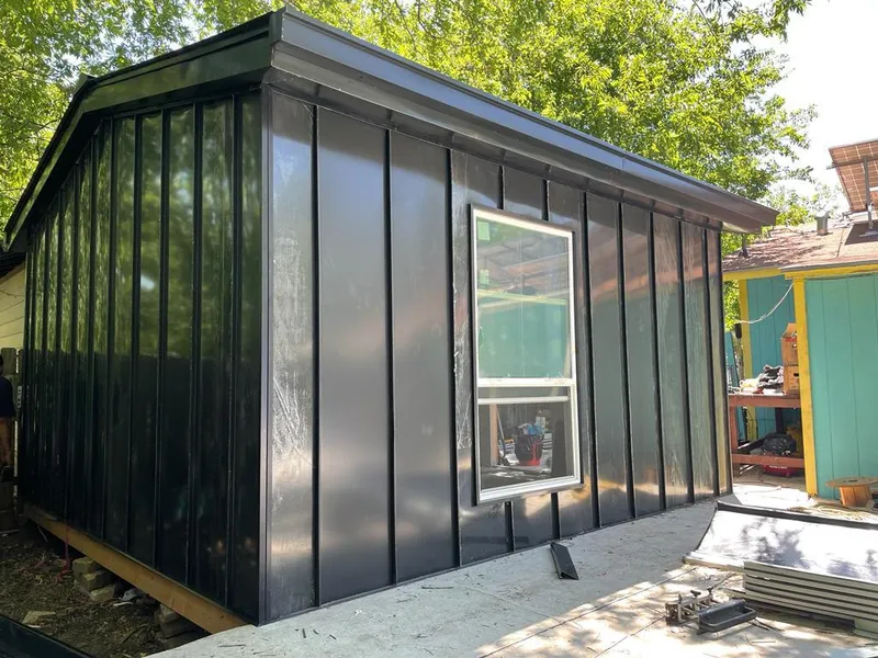 Black standing seam metal wall panels for Roof Inspection in Pearsall