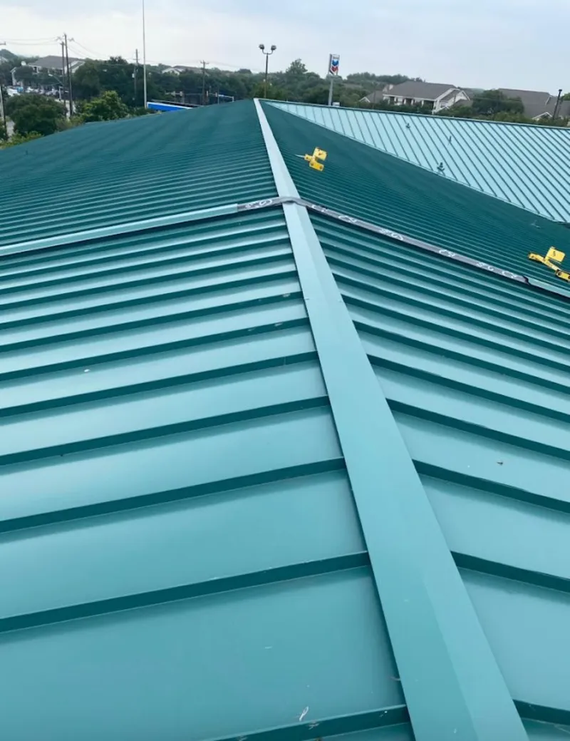 Green commercial metal roof ridge and valley for Metal Roof Repair in Pearsall